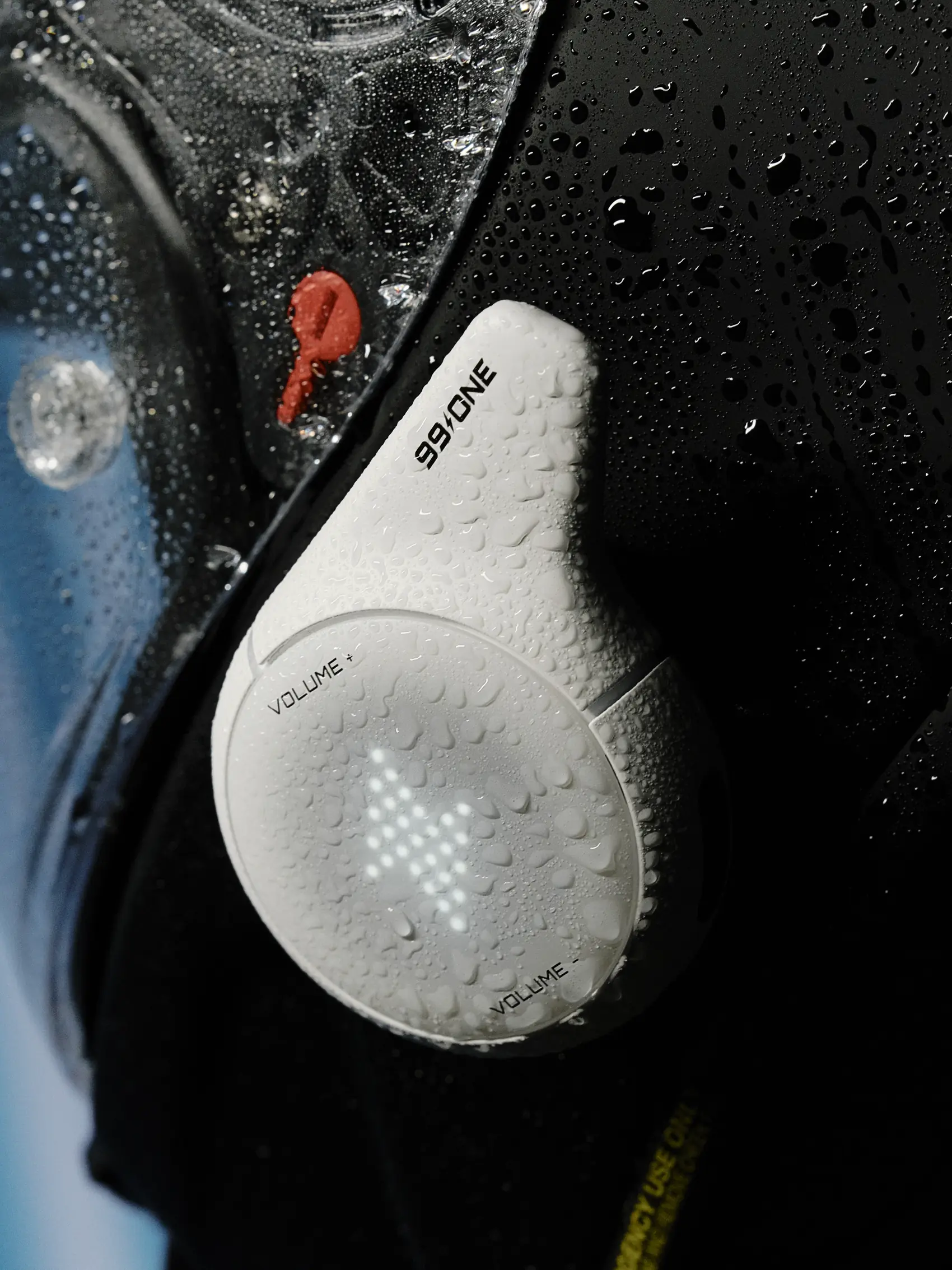 99ONE Rogue in Jet White mounted on a rain-soaked black helmet