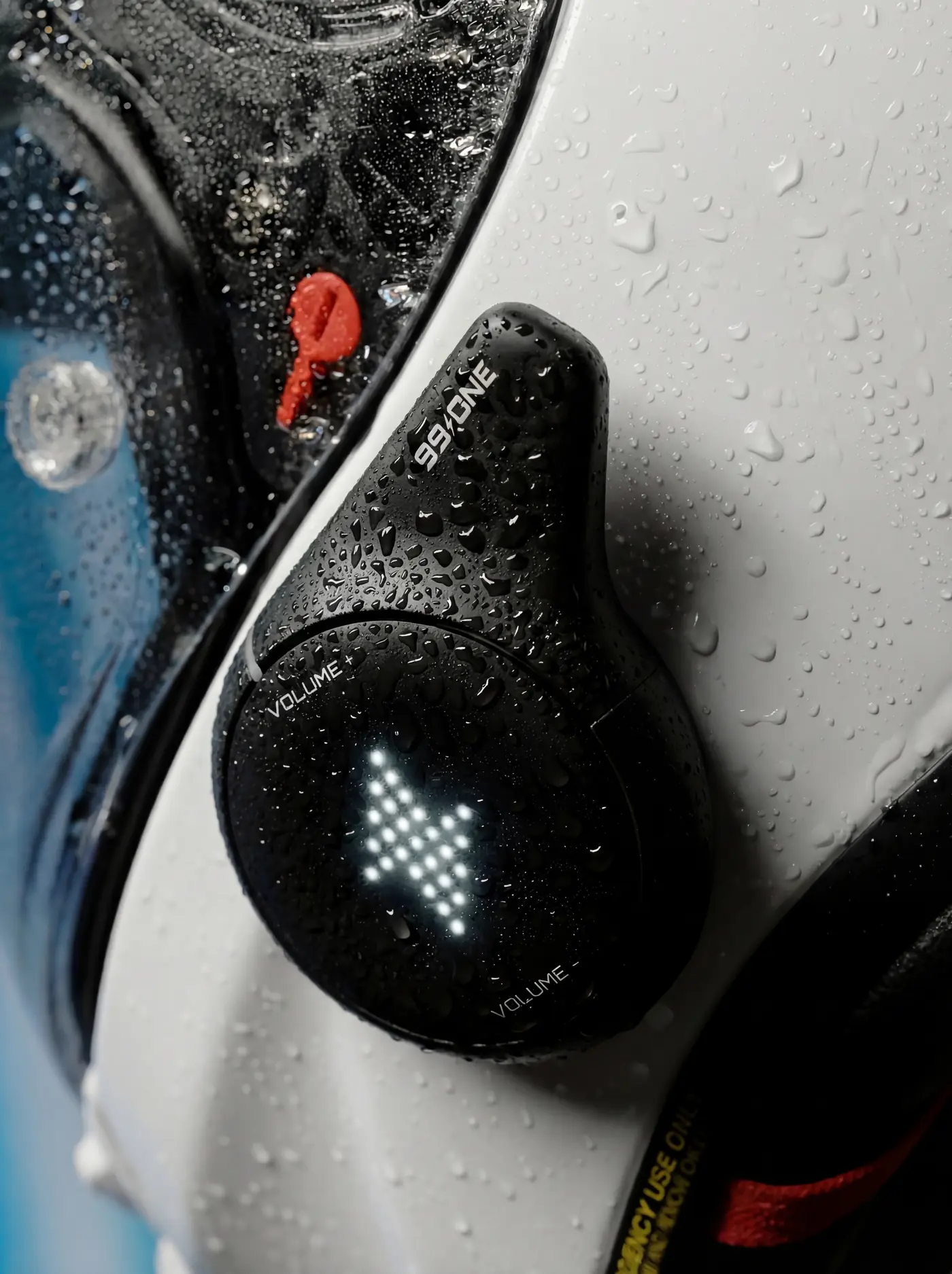 99ONE Rogue in Shadow black, beaded with rain on a white helmet