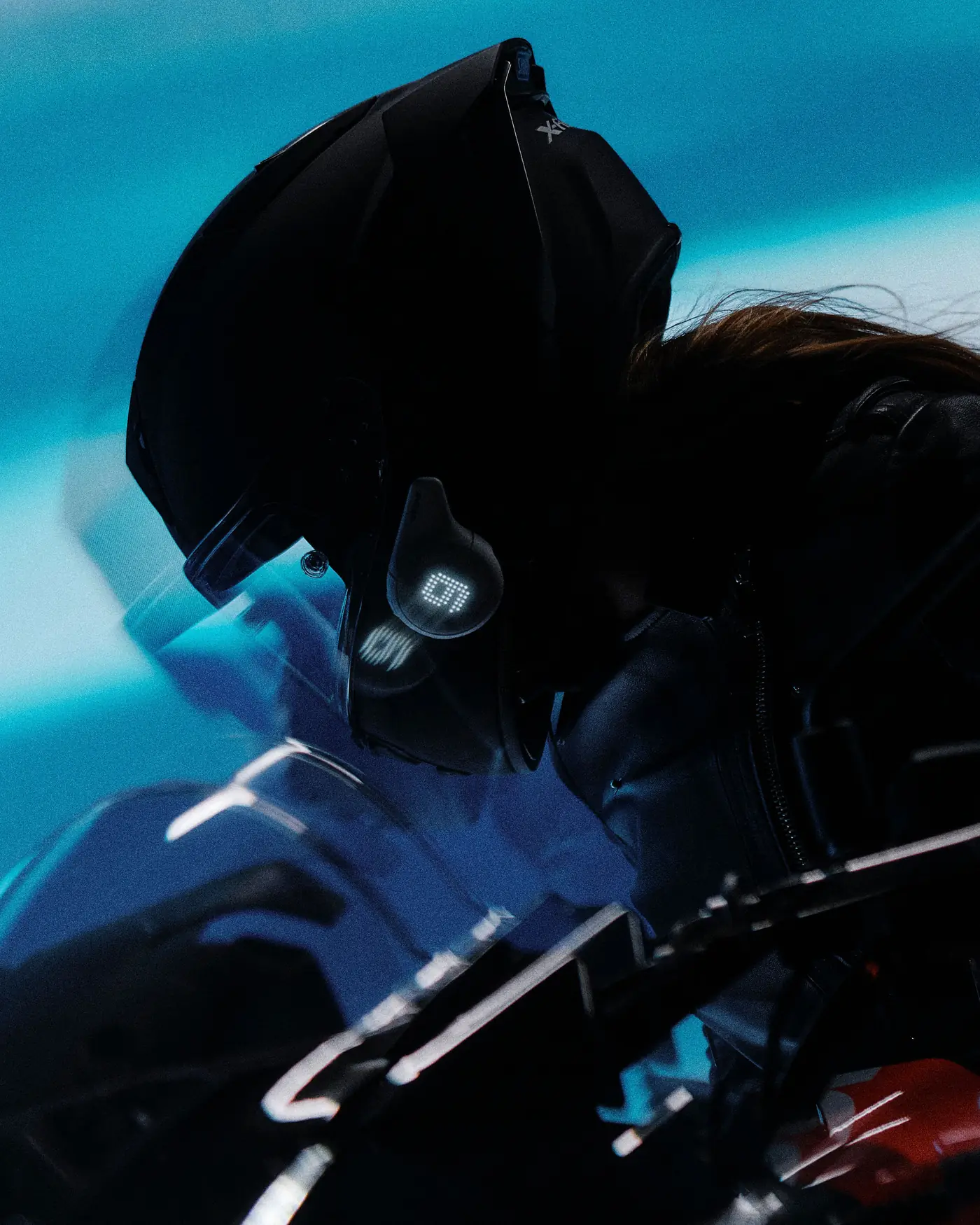 Rider leaning into motion blur with the Rogue lit